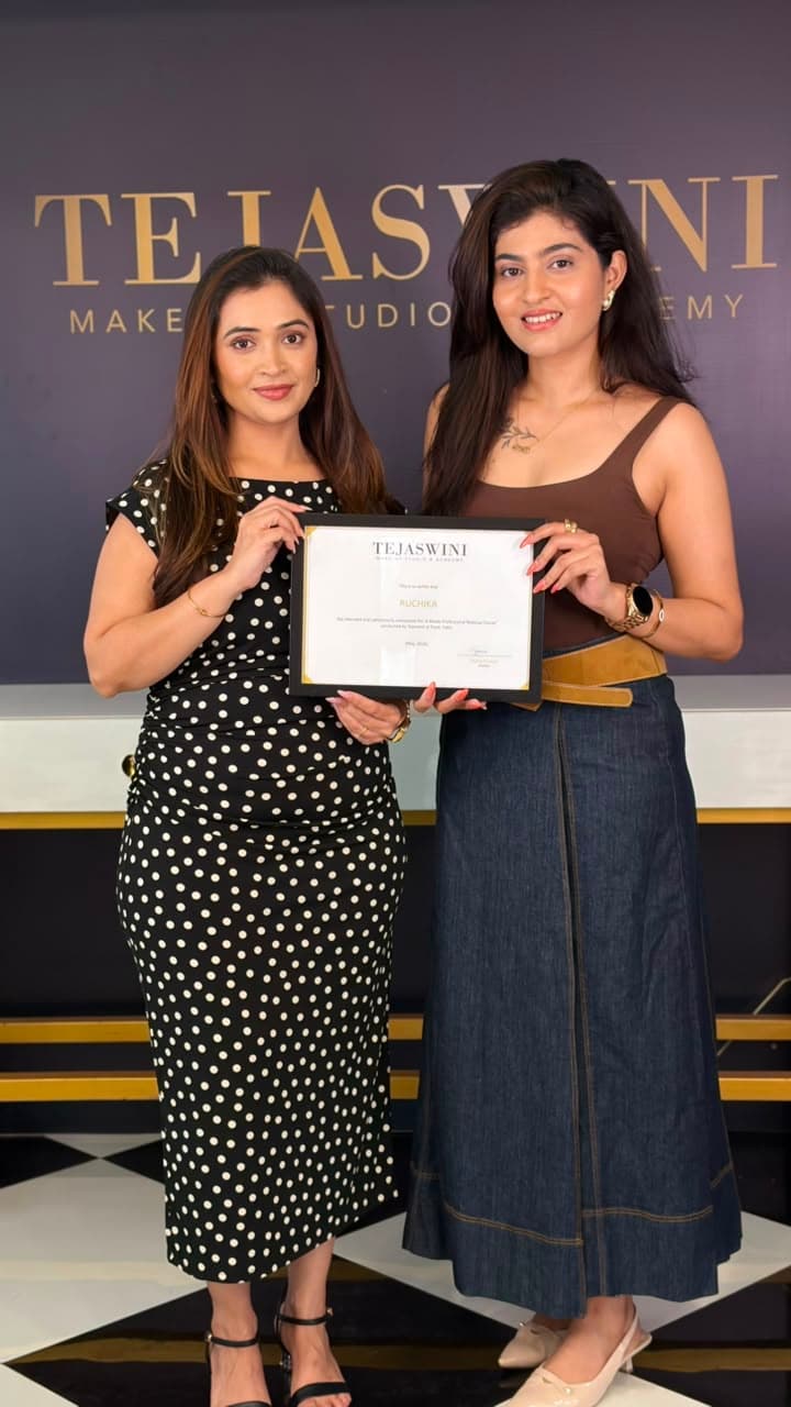 Ruchika holding her certificate from Tejaswini Makeup Studio & Academy